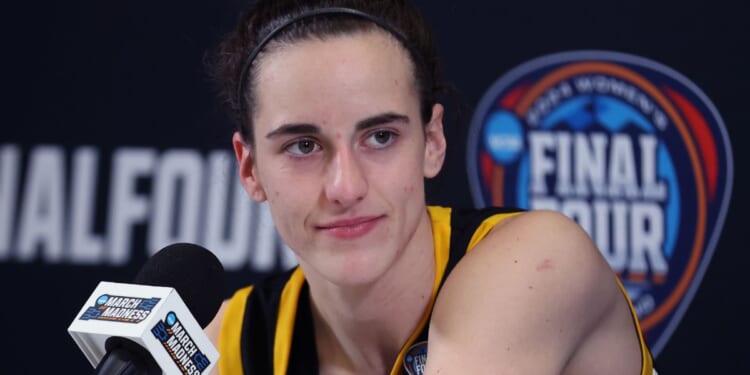 Caitlin Clark of the Iowa Hawkeyes talks with the media after losing to the South Carolina Gamecocks in the 2024 NCAA Women's Basketball Tournament National Championship in Cleveland, Ohio, on Sunday.