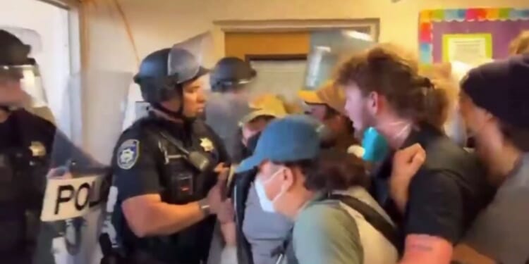 police confronting protesters at Cal Poly Humboldt