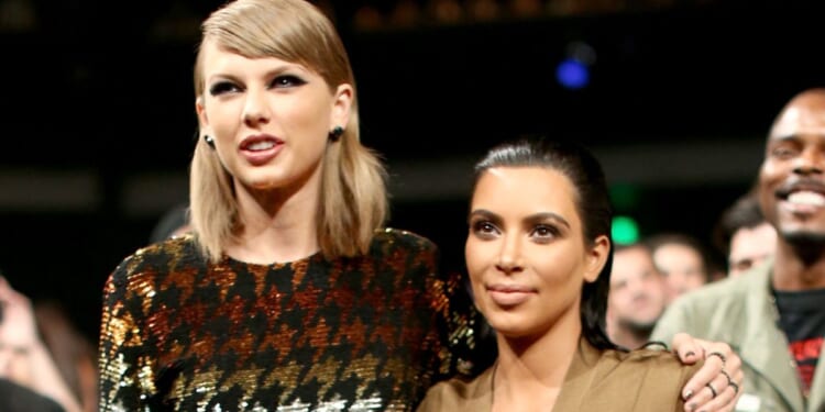 Taylor Swift, left, and Kim Kardashian, right, attend the 2015 MTV Video Music Awards in Los Angeles, California, on Aug. 30,