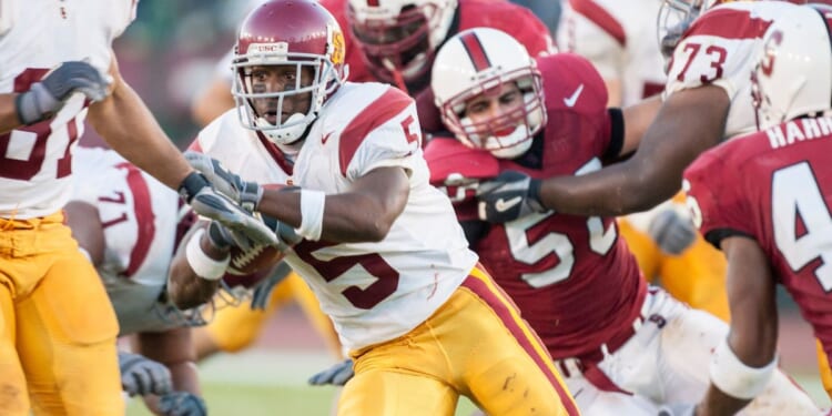 Reggie Bush #5 of the USC Trojans runs the ball during a Pac-10 NCAA football game against the Stanford Cardinals in Palo Alto, California, on Sept. 25, 2004.