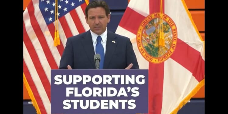 Florida Gov. Ron DeSantis speaks at a news conference in Kissimmee, Florida, at Tohopekaliga High School.