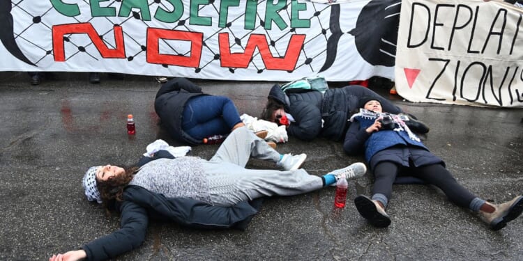 Activists participate in a protest during the pro-Palestine march organized by Let Gaza Live on Jan. 21 in Park City, Utah. The protest took place during day four of the Sundance Film Festival and shut down Park City’s Main Street.