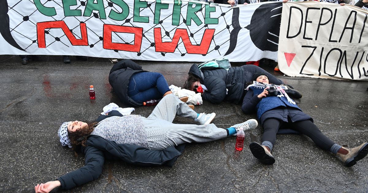 Activists participate in a protest during the pro-Palestine march organized by Let Gaza Live on Jan. 21 in Park City, Utah. The protest took place during day four of the Sundance Film Festival and shut down Park City’s Main Street.