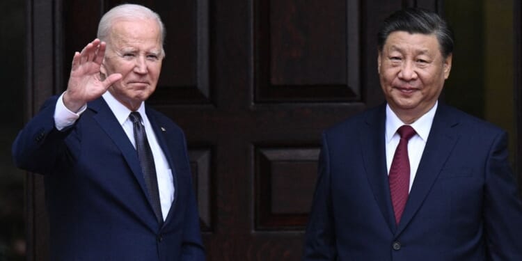 President Joe Biden greets Chinese President Xi Jinping before a meeting in Woodside, California on Nov. 15, 2023.