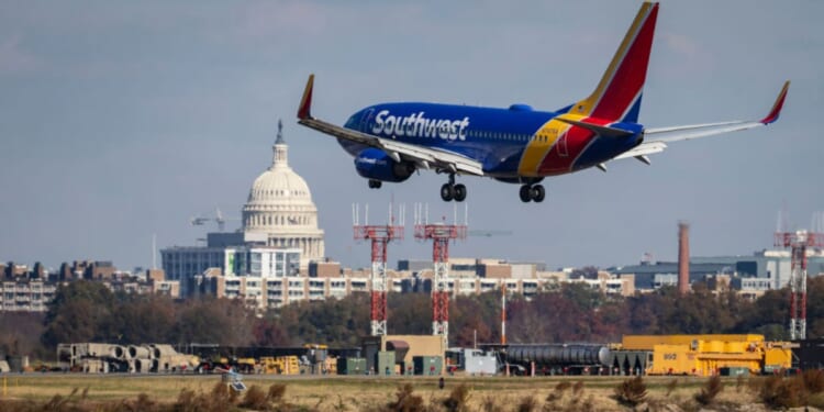 A Southwest Airlines plane is seen in a file photo from November 2021 lands at Ronald Reagan Washington National Airport, where two planes nearly collided this week.