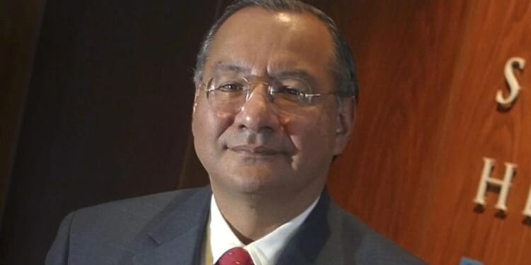 Victor Manuel Rocha poses for a portrait at Steel Hector & Davis in Miami in January 2003, joining the law firm to help open doors in Latin America. Rocha was sentenced Friday to 15 years in federal prison.