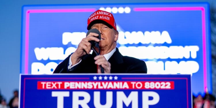 Republican presidential candidate and former President Donald Trump arrives for a rally outside Schnecksville Fire Hall in Schnecksville, Pennsylvania, on April 13.