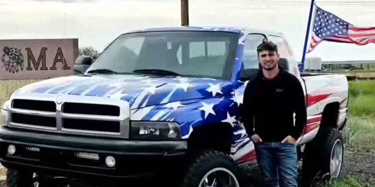 Cameron Blasek poses with his truck in Oklahoma.