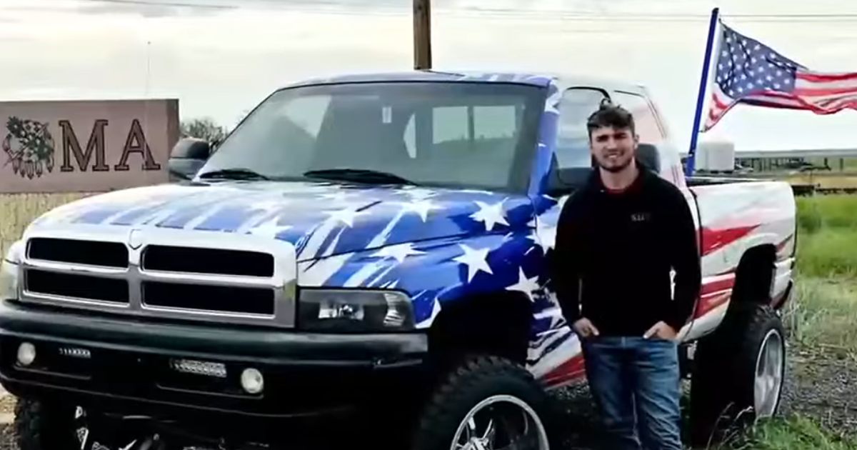 Cameron Blasek poses with his truck in Oklahoma.