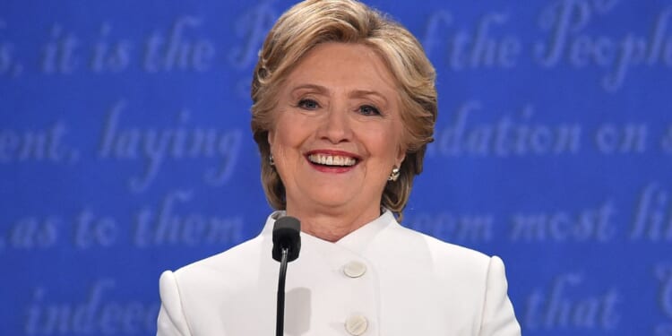 Then-Democratic presidential nominee Hillary Clinton smiles during the final presidential debate against then-Republican candidate Donald Trump in Las Vegas, Nevada on Oct. 19, 2016.