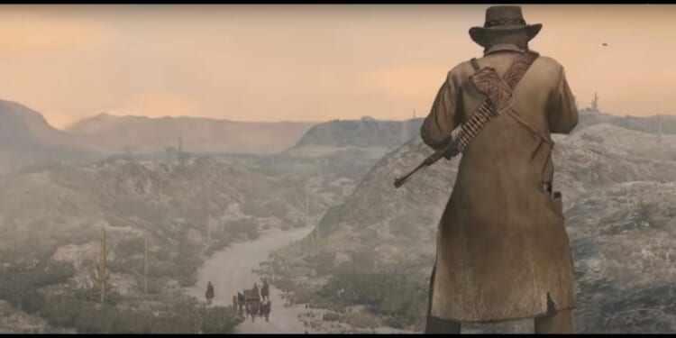 John Marston, the protagonist of "Red Dead Redemption" looking down on a dirt road in the wild west.