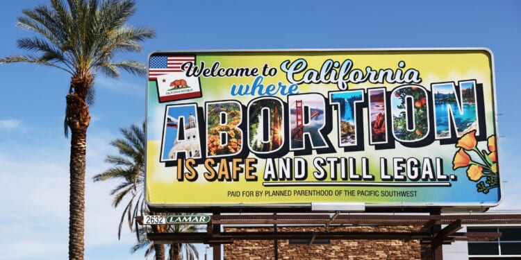 A billboard reads, "Welcome to California where abortion is safe and still legal" on July 12, 2022 in Rancho Mirage, California.