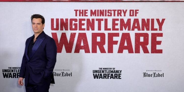 Actor Henry Cavill posing for pictures at the New York Premiere for "The Ministry of Ungentlemanly Warfare."