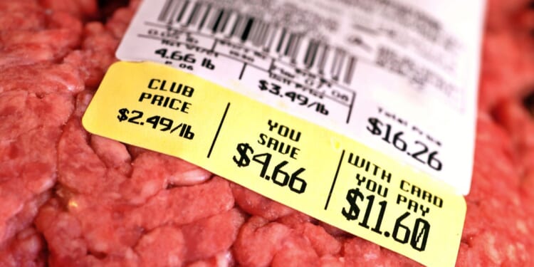 This picture shows a price tag on a large package of raw ground beef.