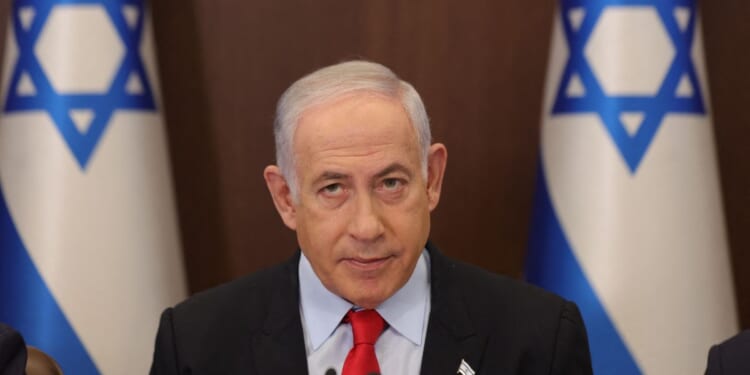 Israeli Prime Minister Benjamin Netanyahu attends the weekly Cabinet meeting at his office in Jerusalem on Sept. 27.