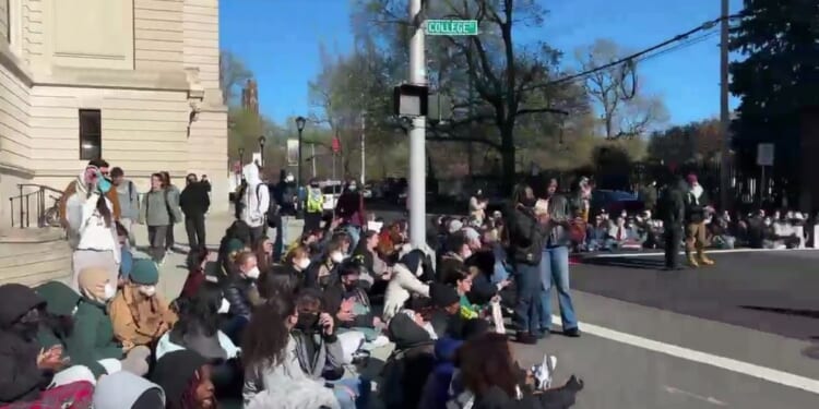 Anti-Israel protesters blocking an intersection at Yale University