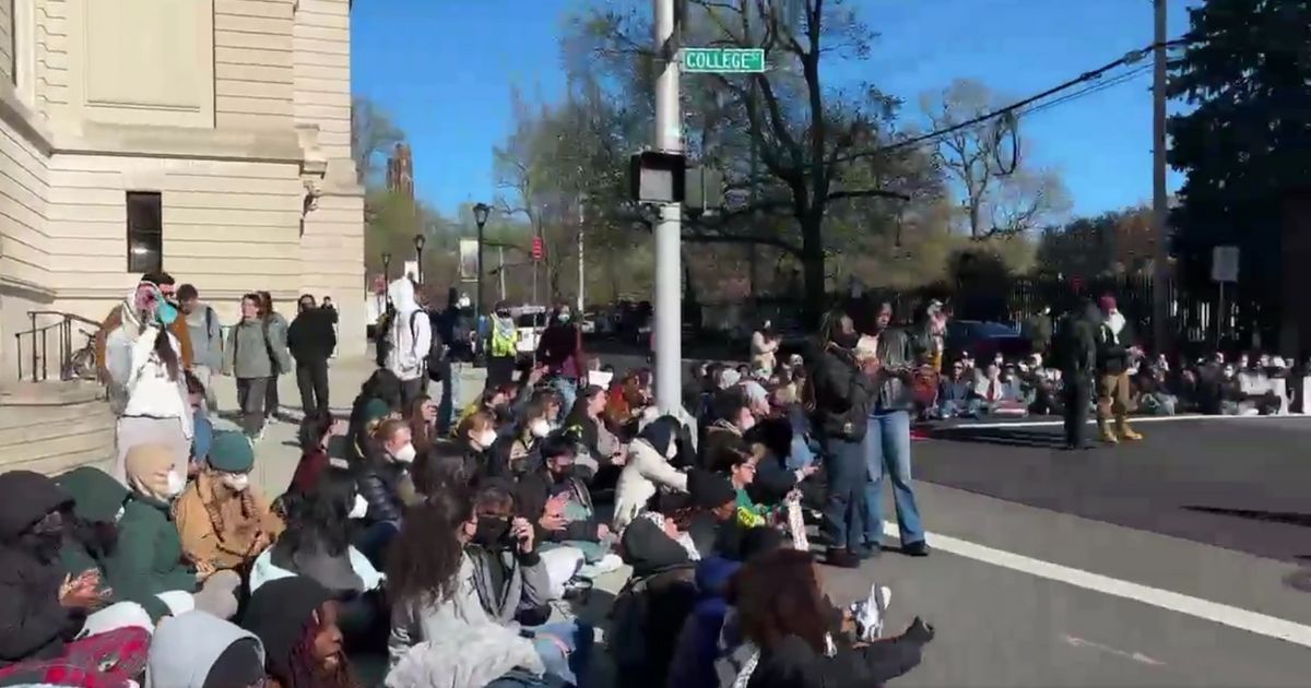 Anti-Israel protesters blocking an intersection at Yale University