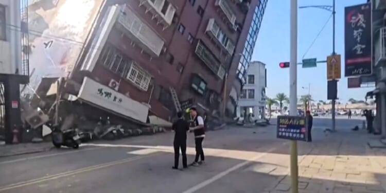 A building tilts to the point of collapse Wednesday in Hualien, Taiwan, after a powerful earthquake struck the country.