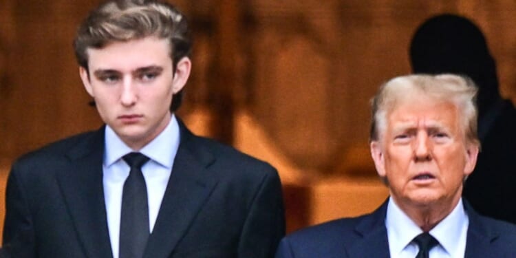 Former President Donald Trump, right, and his son Barron Trump, left, attend the funeral for the former first lady's mother at the Church of Bethesda-by-the-Sea, in Palm Beach, Florida, on Jan. 18.