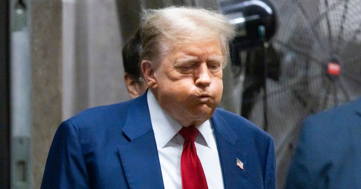 Former President Donald Trump walks back into the courtroom at Manhattan Criminal Court in New York City after a break in his trial on Tuesday.