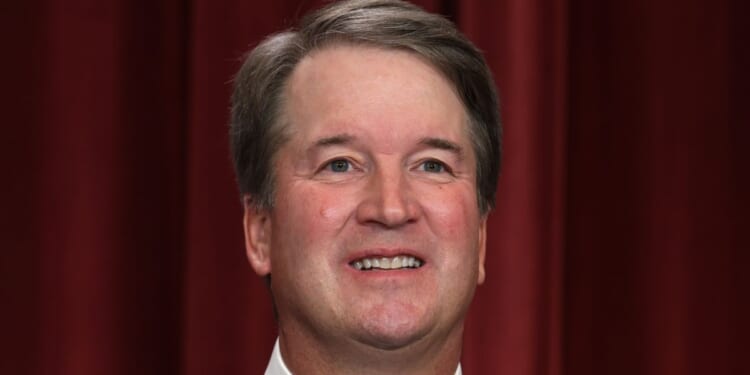 Justice Brett Kavanaugh poses for an official portrait at the East Conference Room of the Supreme Court building in Washington on Oct. 7, 2022.