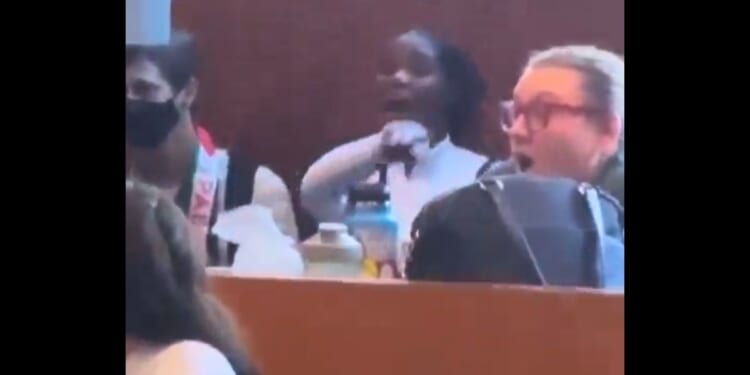 A woman identified as Loyola Marymount University graduate student Grace Obi-Azuike yells at Jewish people.