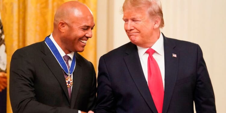 Then-President Donald Trump shakes hands with former New York Yankees pitcher Mariano Rivera after presenting him with the Medal of Freedom in the East Room of the White House in Washington, D.C., on Sept. 16, 2019.