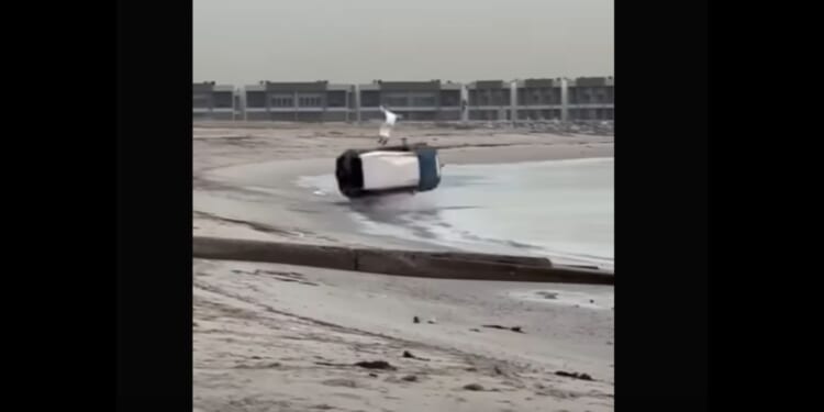 An image from video shows the moment a 4WD loses control and rolls multiple times on Abu Al Hasaniya Beach in Kuwait, with the vehicle's 34-year-old driver miraculously walking away from the wreckage with minor injuries.