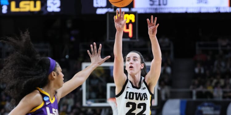 Caitlin Clark of the Iowa Hawkeyes shoots a 3-pointer in front of Angel Reese of the LSU Tigers during the second half of their NCAA Tournament game at MVP Arena in Albany, New York, on Monday.