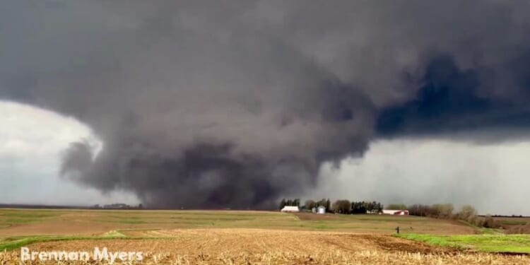 A storm chaser captured one of Friday's huge tornadoes as it tore through farmland near Harlan, Iowa.