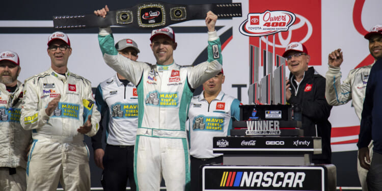 Denny Hamlin celebrates after winning a NASCAR Cup Series race at Richmond Raceway in Richmond, Virginia, on Sunday.