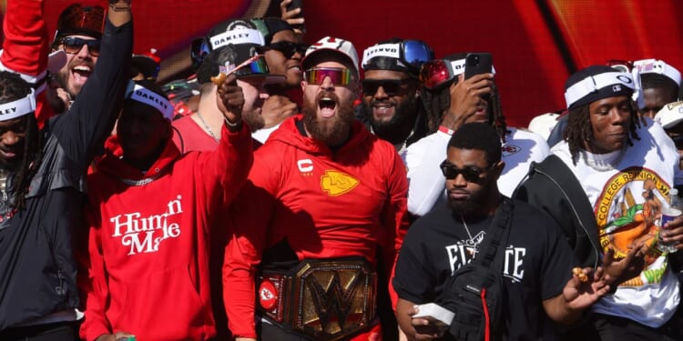 Kansas City Chiefs star Travis Kelce celebrates his teams championship at the Kansas City Chiefs Super Bowl LVIII victory parade in Kansas City, Missouri, in 2024.