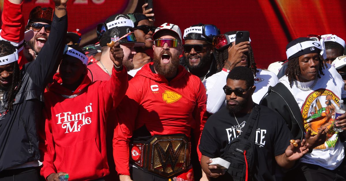 Kansas City Chiefs star Travis Kelce celebrates his teams championship at the Kansas City Chiefs Super Bowl LVIII victory parade in Kansas City, Missouri, in 2024.