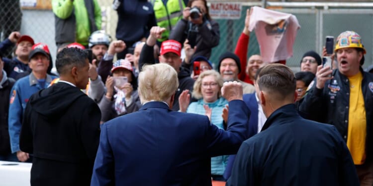 Former President Donald Trump greets union workers at the construction site of the new J.P. Morgan Chase building in New York on Wednesday.