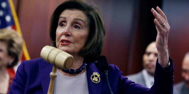 Rep. Nancy Pelosi (D-CA) holds the gavel she used in the House of Representatives 14 years earlier when the Affordable Care Act was passed during a news conference to mark the anniversary at the U.S. Capitol on March 21, 2024 in Washington, DC.