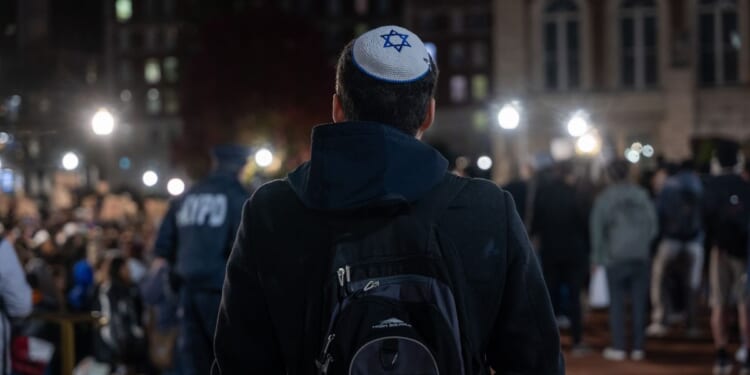 A Jewish student watches a pro-Palestinian demonstration on the Columbia University campus in New York on Nov. 14.