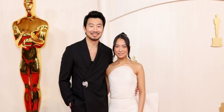 Simu Liu and Allison Hsu attending the 96th Academy Awards in Hollywood, California, on March 10, 2024.