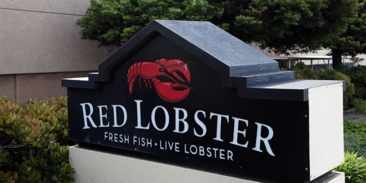 A sign is posted in front of a Red Lobster restaurant in San Bruno, California, in a file photo from 2014.