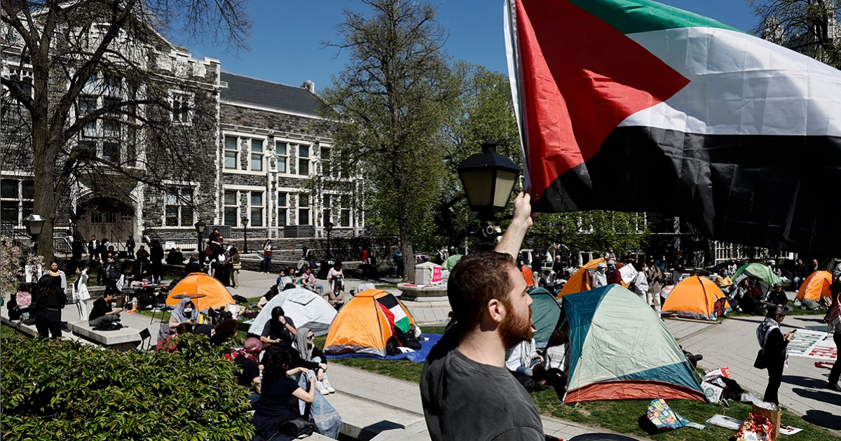 A white man holds a Palestinian flag during a protest at the City University of New York on April 25.