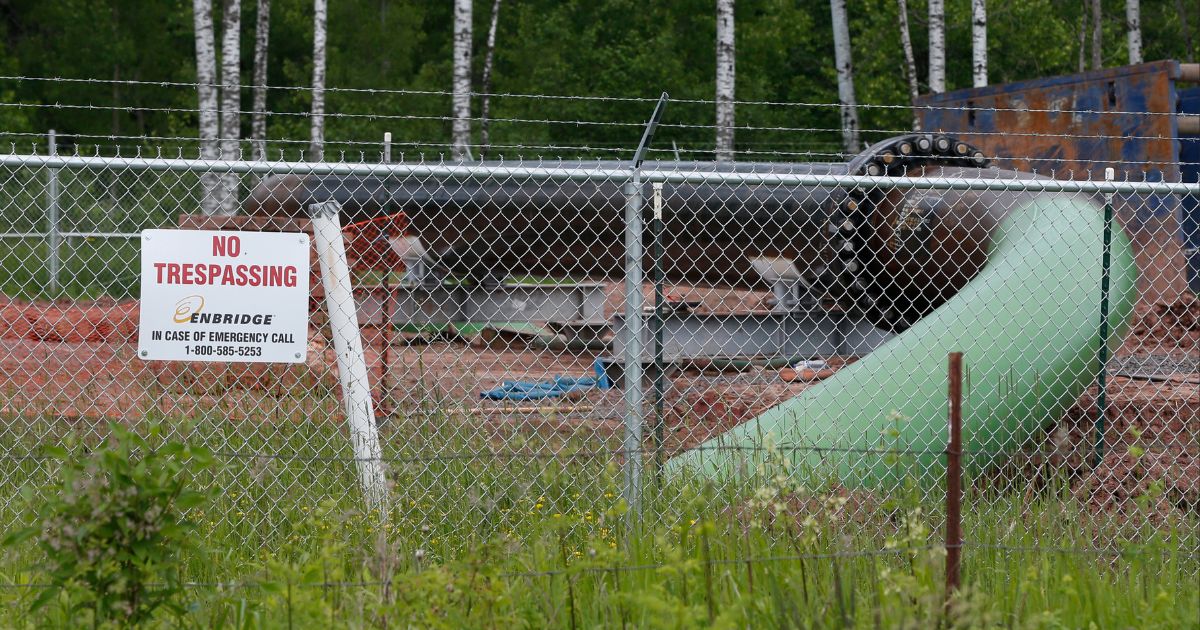 In this file photo from June 29, 2018, a No Trespassing sign is visible at a Enbridge Energy pipeline drilling pad in Minnesota. After President Joe Biden revoked Keystone XL's presidential permit and shut down construction of the long-disputed pipeline that was to carry oil from Canada to Texas, opponents of other pipelines hoped the projects they've been fighting would be next.