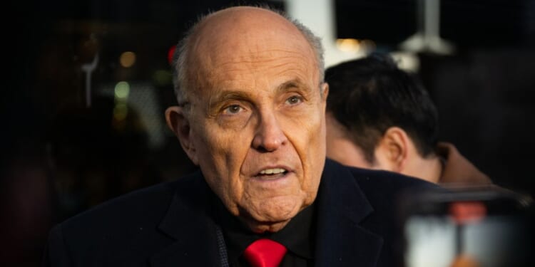 Rudy Giuliani speaks to reporters in Manchester, New Hampshire, on Jan. 21.