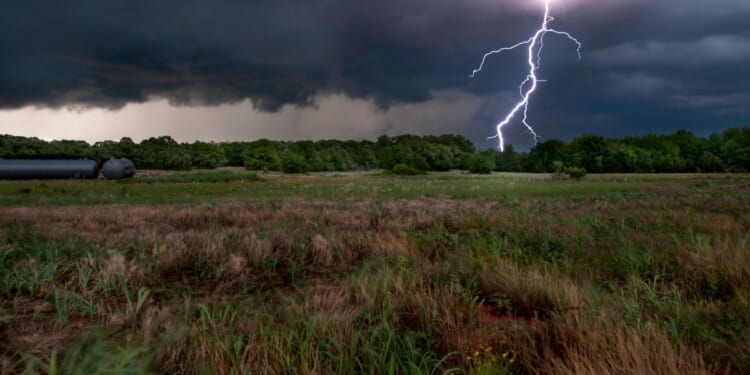 Lightning bolts land near Interstate 35 near Wellington, Kansas, during a spring thunderstorm.