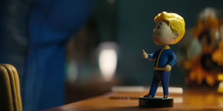 The iconic Vault-Tec bobblehead figure from the Fallout franchise as shown in the Prime Video "Fallout" television series.