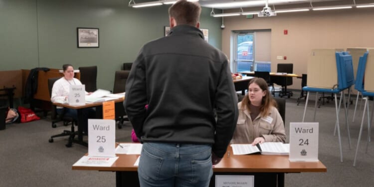 A resident arrives to vote in Wisconsin's primary election at a polling location in Green Bay on Tuesday.