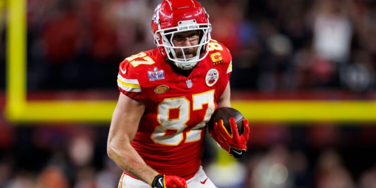 Travis Kelce of the Kansas City Chiefs runs the ball after a catch during Super Bowl LVIII against the San Francisco 49ers in Las Vegas, Nevada, on Feb. 11.