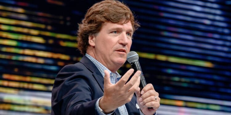 Tucker Carlson speaks during the 10X Growth Conference at the Diplomat Beach Resort in Hollywood, Florida, on April 2.