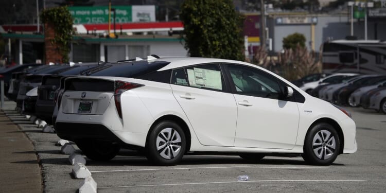 Brand new Toyota Prius cars are displayed on a sales lot at City Toyota in Daly City, California, on Sept. 5, 2018.