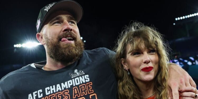 Travis Kelce, left, of the Kansas City Chiefs celebrates with Taylor Swift, right, after defeating the Baltimore Ravens in the AFC Championship Game in Baltimore, Maryland, on Jan. 28.