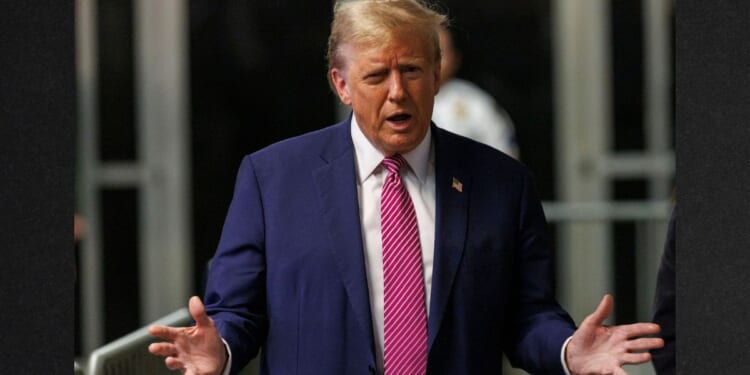 Former President Donald Trump speaks to the media as he exits the Manhattan Criminal Court Friday during his trial for allegedly covering up hush money payments.