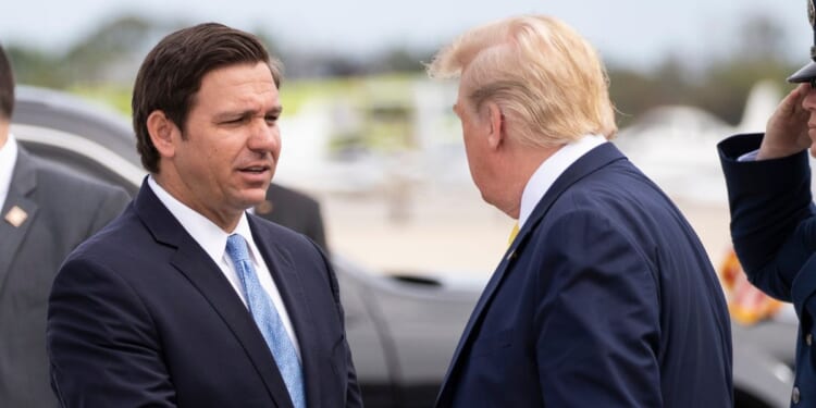 Ron DeSantis greeting Donald Trump at the Orlando airport in 2020